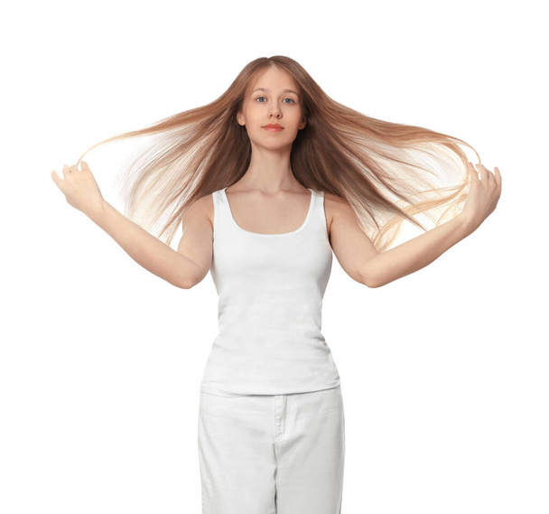 Teenage girl with strong healthy hair on white background - Foto, afbeelding