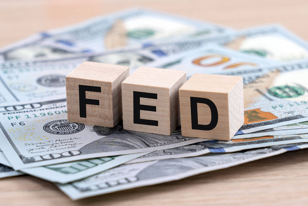 The word FED Federal Reserve on US dollars as the economy concept, interest rates control to help world economy crisis - Photo, Image