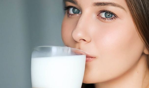 Diet and wellness, young woman drinking milk or protein shake cocktail, portrait - Valokuva, kuva