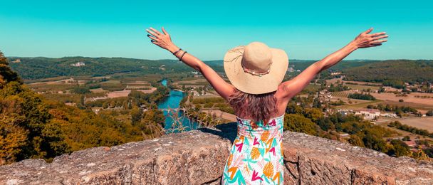 holiday maker looking panoramic view of dordogne river - 写真・画像