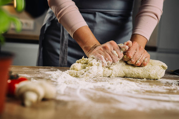 woman making dough in home kitchen - Photo, Image