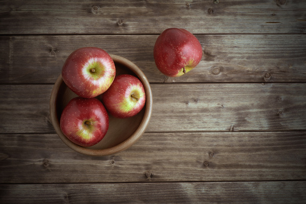 apples in a wooden saucer - Photo, Image