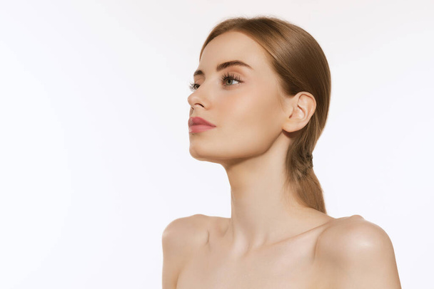 Idea neck and naked shoulders. Closeup portrait of beautiful young girl with clean well-kept skin isolated over white background. Skin care. Cosmetology, youth, beauty and spa. - Foto, immagini