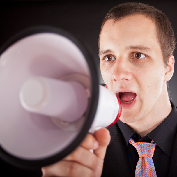 businessman shouting through megaphone - Zdjęcie, obraz