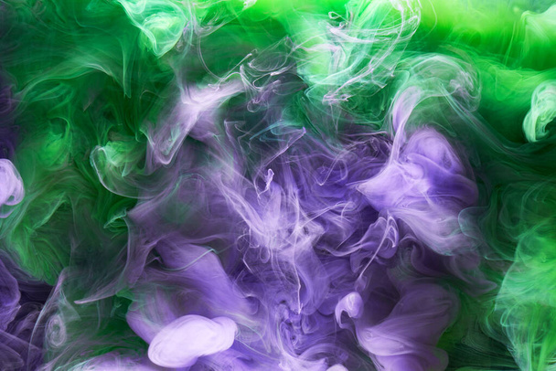 Green purple smoke abstract background, acrylic paint underwater explosion - Photo, Image