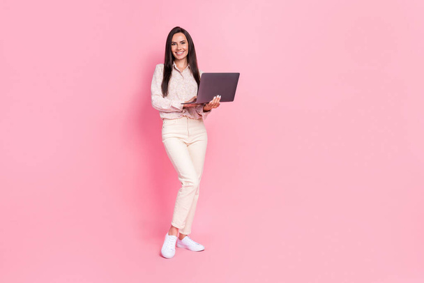 Full size photo of positive lady assistant using device modern technology isolated on pastel color background. - 写真・画像