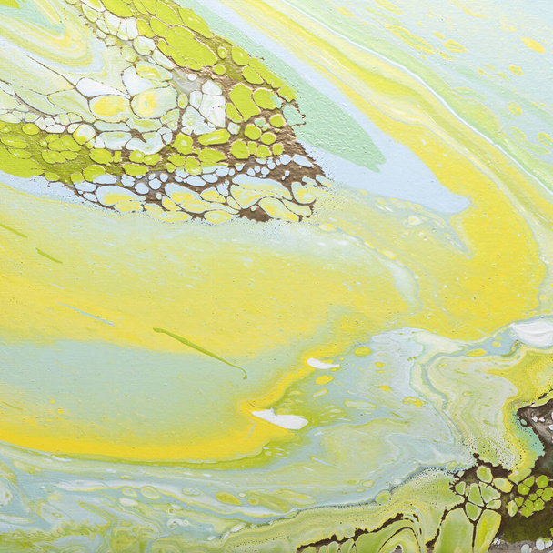 Fluid acrylic painting in green and yellow colors, selective focus image - Fotoğraf, Görsel