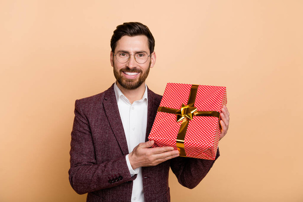 Photo of young positive mam receive birthday present from colleagues isolated on beige color background. - Fotoğraf, Görsel