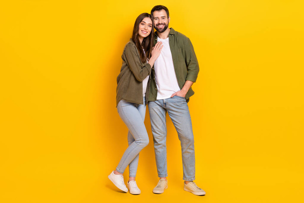 Full length photo of beautiful couple stand together go walk together during weekends isolated on yellow color background. - Fotó, kép