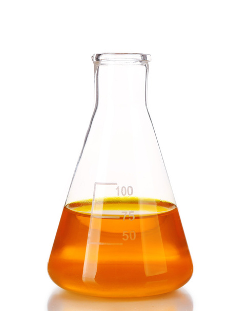 Flask with orange fluid isolated on white - Photo, image