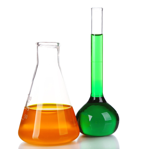 Two flasks with green and orange fluid isolated on white - Photo, image