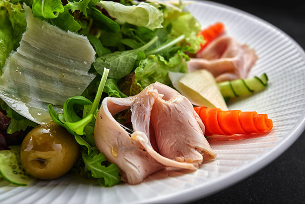 Sous vide turkey salad with vegetables and olive dressing - Photo, Image