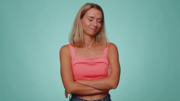 Displeased upset woman reacting to unpleasant awful idea, dissatisfied with bad quality, wave hand, shake head No, dismiss idea, dont like proposal. Young adult girl alone on blue studio background - Footage, Video
