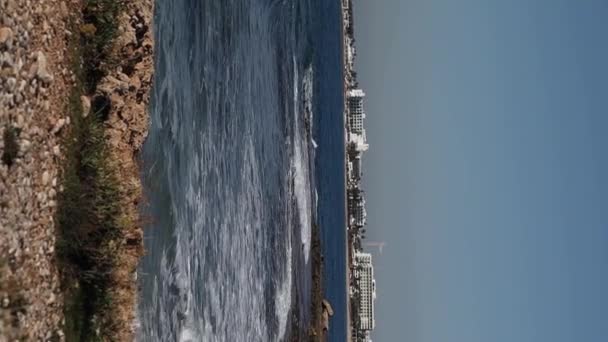 Beautiful seashore with waves on horizon and sandy beach with pebbles in Aiya Napa, Cyprus - Footage, Video