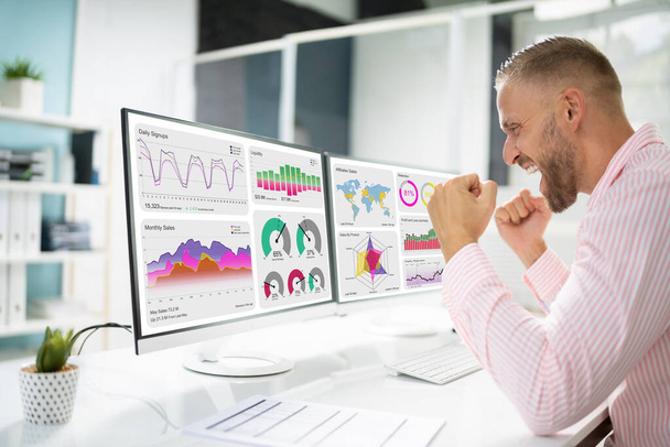 Excited Business Analyst Using Data Dashboard On Computer And Celebrating Win - Photo, Image