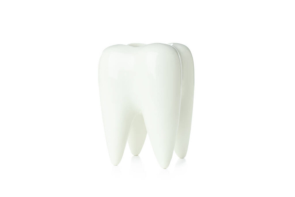 Concept of dental care, decorative tooth isolated on white background - Fotó, kép