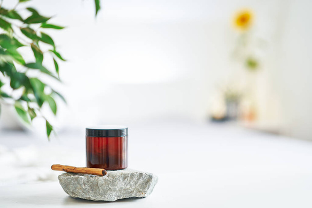 Set of oil and wooden stick on rock for massage. High quality photo - Fotografie, Obrázek