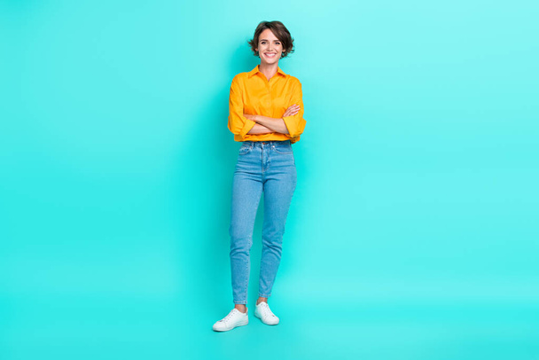 Full length photo of good looking positive pretty lady wear trendy clothes outfit stand empty space isolated on aquamarine color background. - Foto, immagini