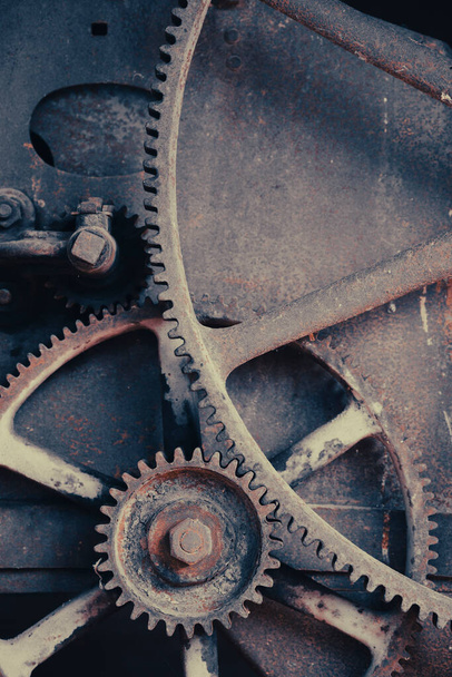 Rusty large gears from old mechanism photographed at close range. - Φωτογραφία, εικόνα