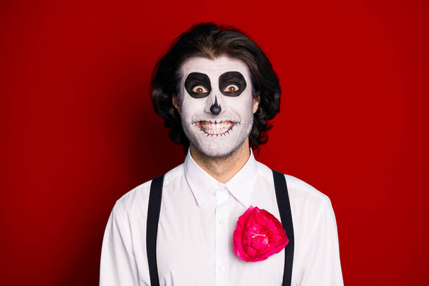 Close-up portrait of his he nice handsome cheerful cheery brunet guy wearing elegant clothes look creepy make-up catrina isolated over bright vivid shine vibrant red color background. - 写真・画像