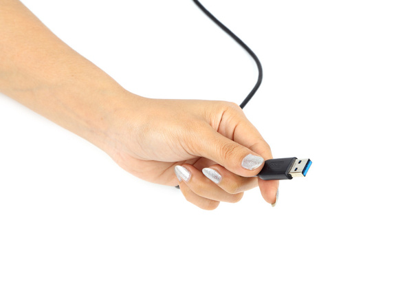 USB 3.0 plug cable in hand - 写真・画像