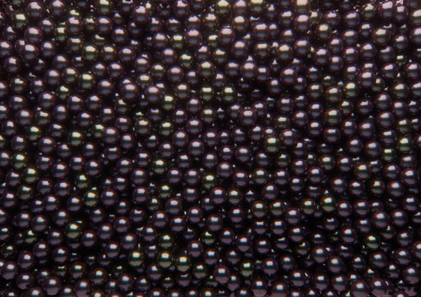 Tablica czarnych błyszczących pereł rozłożonych na stałe - renderowanie 3D - Zdjęcie, obraz