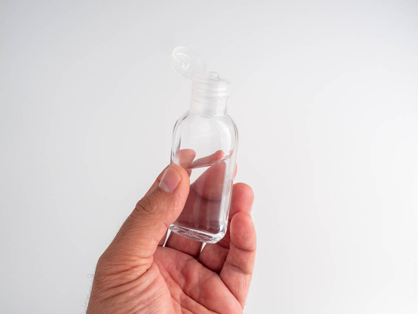 Hand sanitizer. Gel for hand hygiene. Antiseptic hand washing. Hand sanitizer with alcohol on a white background. Coronavirus protection. covid-19, coronavirus pandemic. - Foto, afbeelding