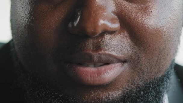 Close up african male face portrait of bearded plus size man client businessman speaker blogger talking to camera recording video instruction interview blog saying motivational speech teaching online - Footage, Video