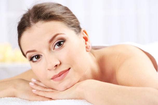 Beautiful young woman having relax in spa salon - Photo, Image