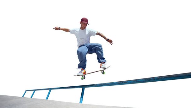 Skateboarder doing a trick isolated on white background - Photo, Image