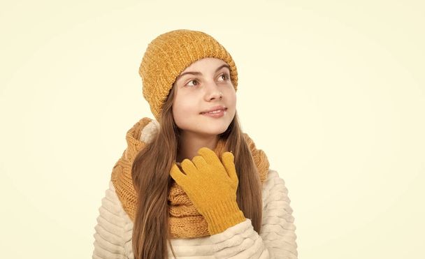 small kid wear knitwear isolated on white. child in hat gloves and sweater. autumn fashion style. warm clothes. happy teen girl in winter clothes. childhood happiness. Confident in her choice. - Foto, imagen