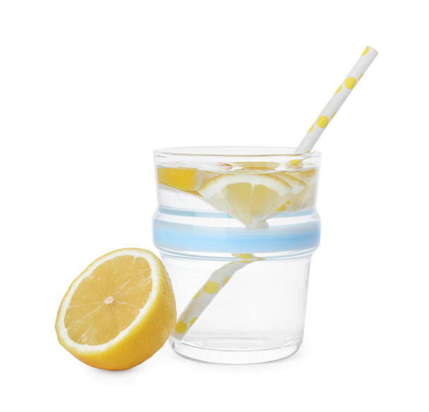 Glass with water and sliced lemon on white background - Photo, Image