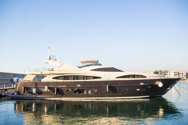 A modern beautiful yacht is moored near the pier - Photo, Image
