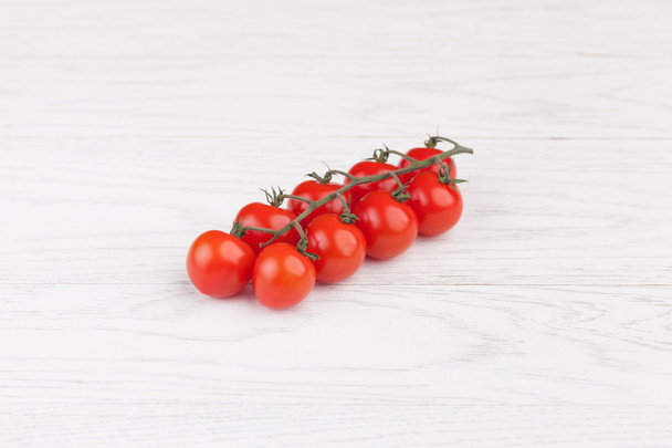 Tomatoes on a wooden table - Фото, зображення