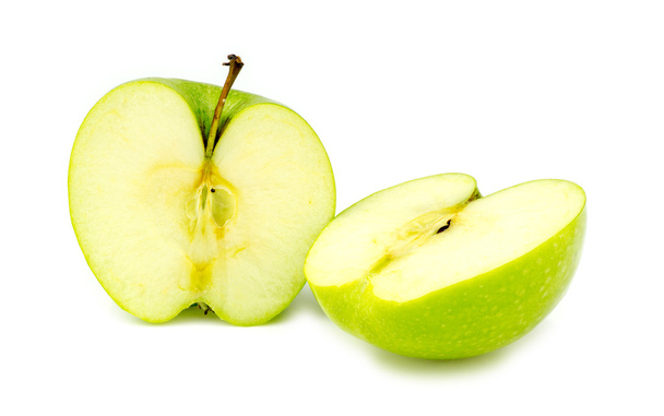 gehackte Hälften frischer grüner Bio-Oma-Schmied-Apfel - Foto, Bild