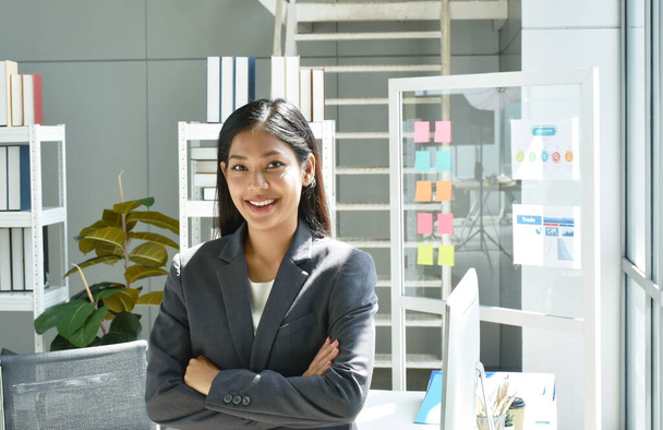 happy beautiful busimess Asian woman posing in glass window background with success moment at office - Photo, Image