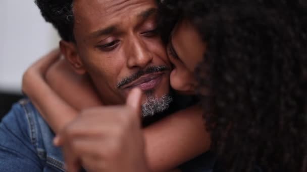 Preteen kid kissing dad in the cheek and embracing lifting parent mood - Footage, Video