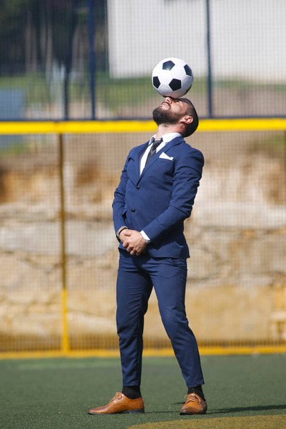 European Football Championship concept. Businessman playing soccer ball. - Photo, Image