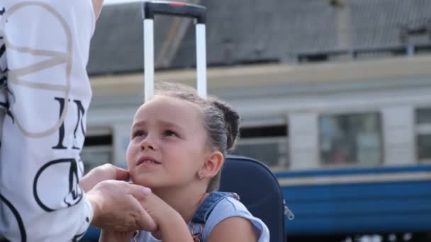 The child says goodbye to his mother at the railway station. A difficult scene. Children of war. Stop the war in Ukraine - Footage, Video