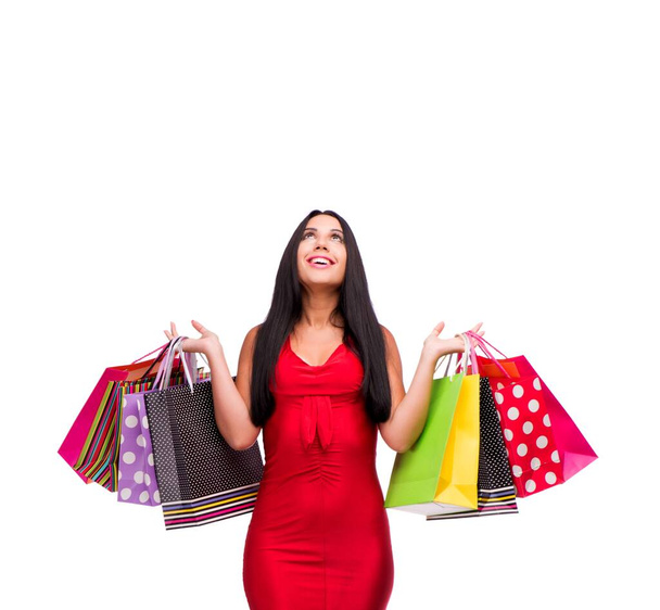 La mujer en rojo dres después de comprar aislado en blanco - Foto, Imagen