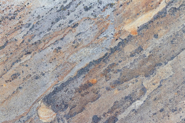Textura de un muro de piedra con grietas y arañazos que se puede utilizar como respaldo. La textura de la piedra. - Foto, imagen