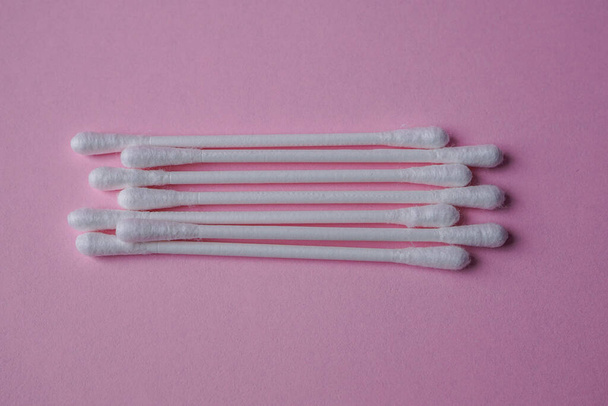 cotton swabs on the pink background, cosmetics and hygiene  - 写真・画像