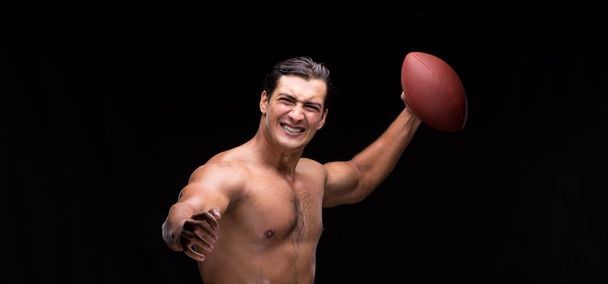 The ripped muscular man with american football - Fotografie, Obrázek
