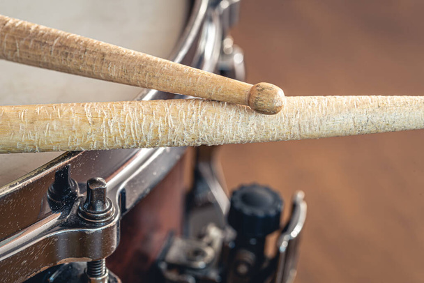 Close-up, drumsticks on a blurred background, macro shot. - Foto, imagen