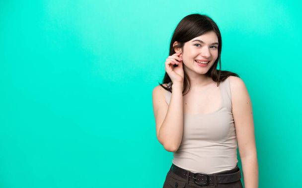 Young Russian woman isolated on green background laughing - Foto, Imagen