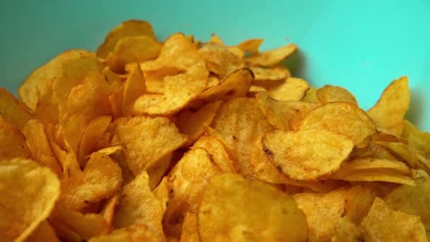 Potato chips rotating close up. Fast food snacks. High quality 4k footage - Filmagem, Vídeo