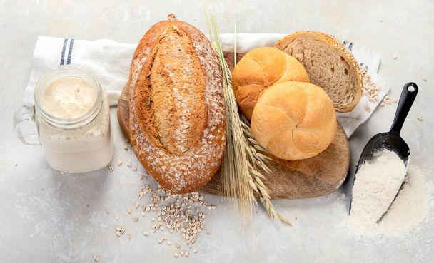 Bread assortment on neutral background. Fresh homemade pastry. Top view - Φωτογραφία, εικόνα