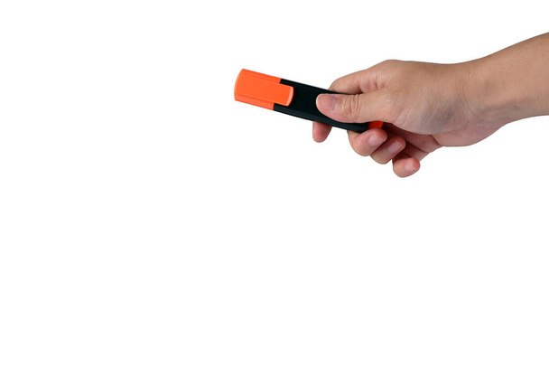 Hand holding orange marker on white background. - Foto, Imagem