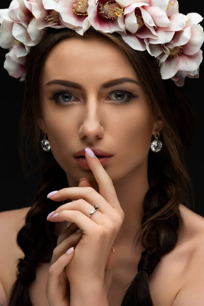 Beautiful young brunette woman wearing a delicately pink floral wreath. Wedding headdress for girls. Ukrainian beauty. High quality photo - Фото, зображення