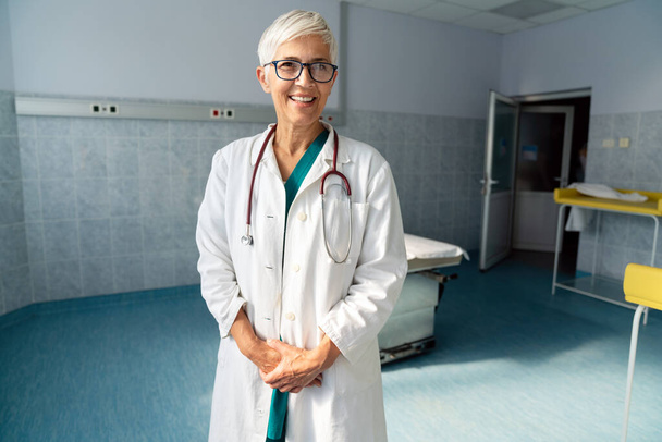 Portrait of successful female doctor in hospital. Healthcare, medicine, people concept - Фото, зображення